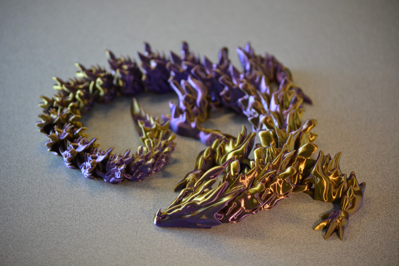 Bone Dragon articulated dragon in an iridescent purple and gold finish
